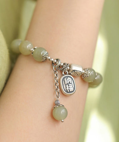 Conjunto de dos piezas de pulsera y anillos con dijes de jade en plata esterlina verde claro de Boutique 