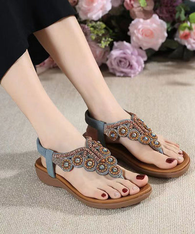 Sandalias planas de cuña con circonitas negras y diseño bohemio 