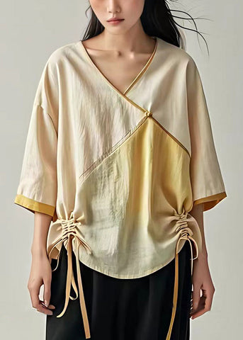 Brazalete de lino con patchwork y cordones en beige 