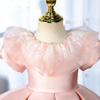 Elegantes rosa Prinzessinnenkleid mit Puffärmeln für Babys und Kleinkinder – auch ideal zur Erstkommunion 