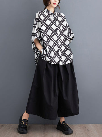 Blusas y camisas con solapas estampadas a cuadros con botones altos y bajos y mangas murciélago 