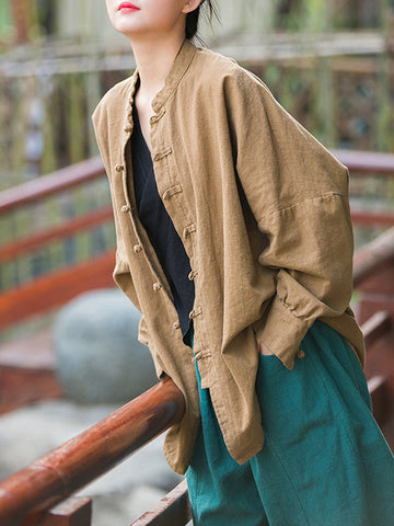 Blusas plisadas de color liso con cuello alto, mangas murciélago y botones de rana chinos sueltos. 