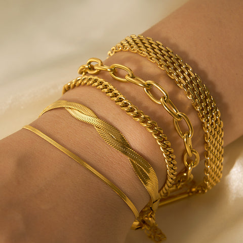 Pulseras de cadena de acero y titanio dorado con hueso de serpiente 