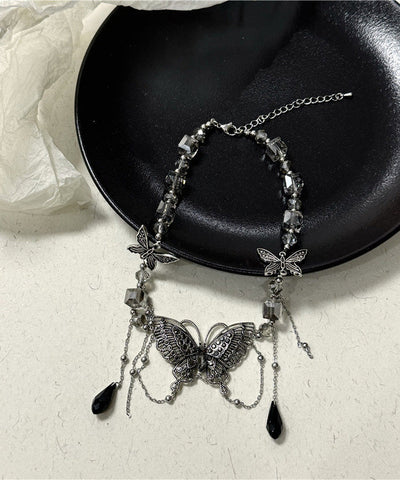 Collar de lazo con borla hueca y mariposa de circonita y cristal de acero inoxidable morado a la moda 