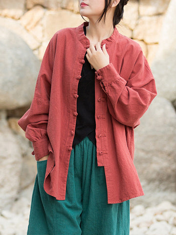 Blusas plisadas de color liso con cuello alto, mangas murciélago y botones de rana chinos sueltos. 