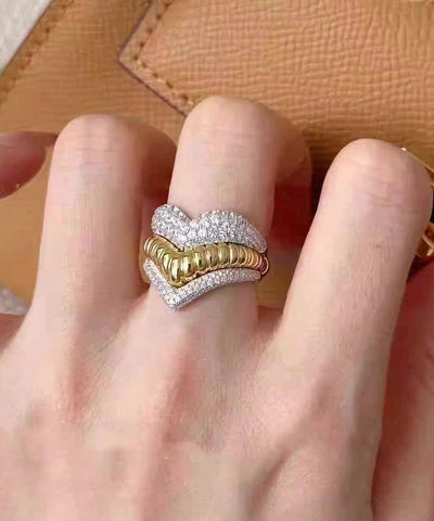 Conjunto de dos anillos únicos de plata de ley con circonitas multicapa y forma de corazón con rayas de amor 