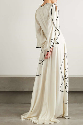 Vestido largo de satén con estampado floral y volantes 