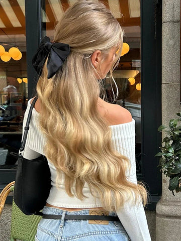 Suéter elegante con hombros descubiertos 