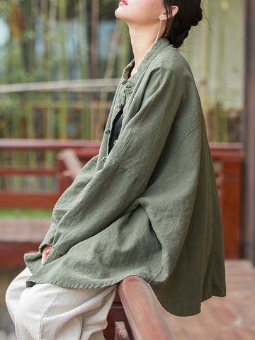 Blusas plisadas de color liso con cuello alto, mangas murciélago y botones de rana chinos sueltos. 