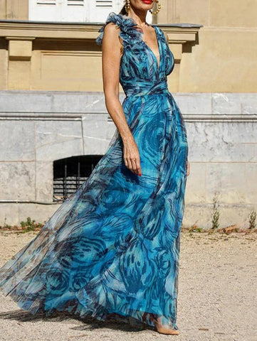 Vestido largo con estampado floral estéreo en azul pavo real 