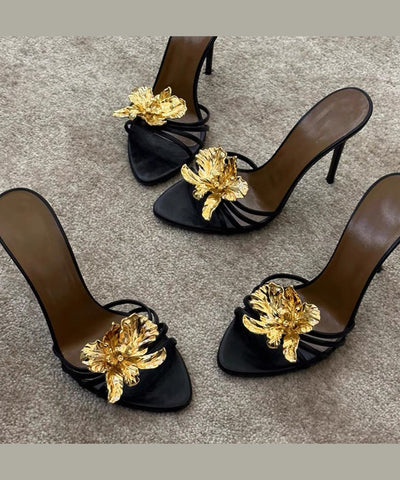 Schwarze Stiletto-Sandalen aus Kunstleder mit Blumenmuster 