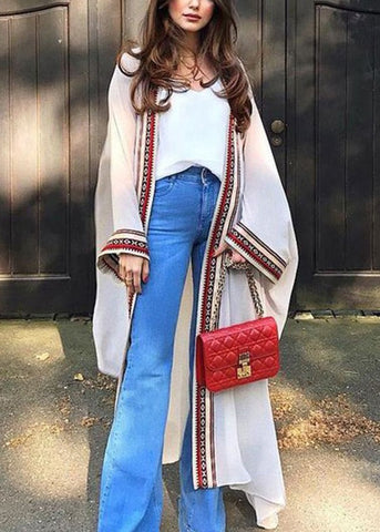 Cárdigan holgado de gasa con lazo en la cintura, bordado en negro y manga larga 