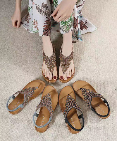Sandalias planas de cuña con circonitas negras y diseño bohemio 