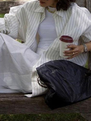 Blusas de solapa a rayas con aberturas laterales, mangas largas y corte irregular 