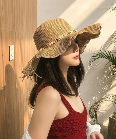 Sombrero para el sol flexible tejido de paja con cuentas de clavo de color caqui y UPF 50+ 