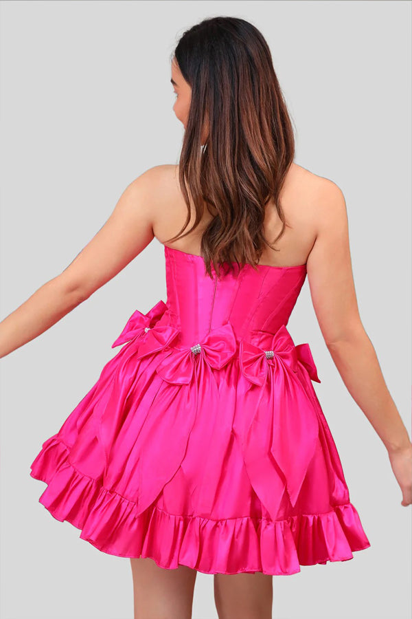 Vestido de fiesta fucsia con corsé, corto, sin tirantes y lazos