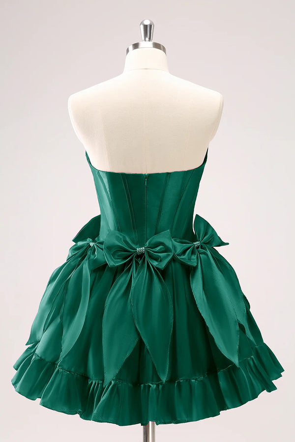 Vestido de fiesta fucsia con corsé, corto, sin tirantes y lazos