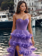 Vestido de fiesta con capas escalonadas, sin tirantes y con top de corsé plisado y transparente