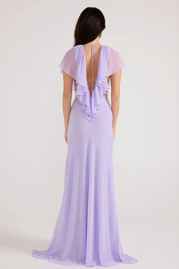 Vestidos de fiesta largos de gasa color lavanda con escote en V profundo, ribete de volantes y falda de sirena con lazo en la espalda para bailes de graduación y bodas en el jardín.