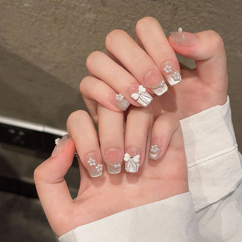 10 uñas postizas hechas a mano, color nude, rosa ruborizado, brillantes, estilo ojo de gato, con diseños de lazo, uñas postizas francesas, reutilizables. 