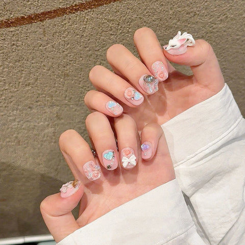 10 uñas postizas cuadradas cortas en rosa claro, hechas a mano, con lazos de flores de zorro 3D y diseños de mariposas. 