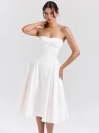 Elegante vestido de vacaciones de corte A con cintura cruzada y midi