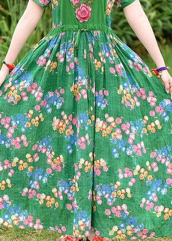 Vestido de verano francés de algodón con estampado verde y lazo en la cintura bordado. 
