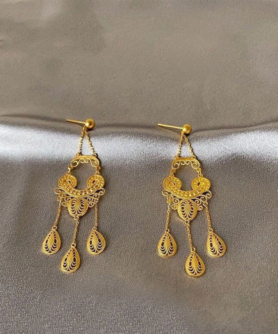 Pendientes colgantes con borlas doradas de moda 