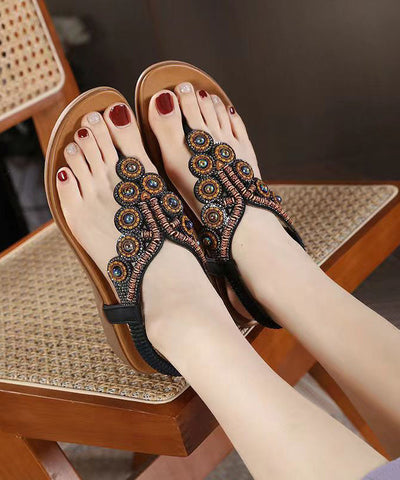 Sandalias planas de cuña con circonitas negras y diseño bohemio 