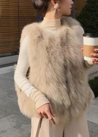 Elegante chaleco de piel y piel color albaricoque, sin mangas, con cuello redondo y cremallera 