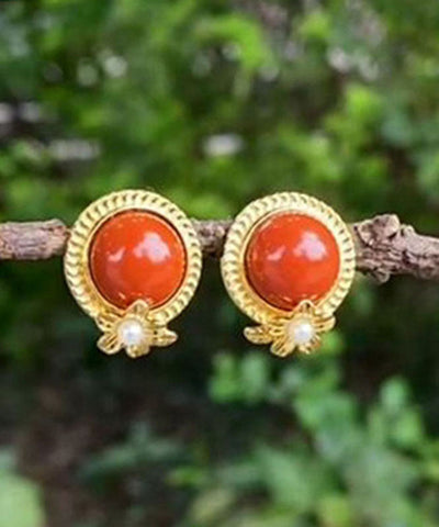 Pendientes de plata de ley roja con ágata dorada y perla. 