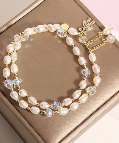 Pulsera informal con dije de osito de perla con incrustaciones de aleación de champán 