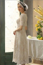 Hermosos vestidos de novia cortos de encaje con corte A y mangas 3/4