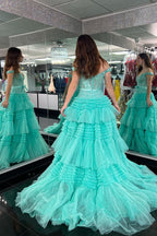 Vestido de fiesta largo rosa claro con hombros descubiertos y volantes