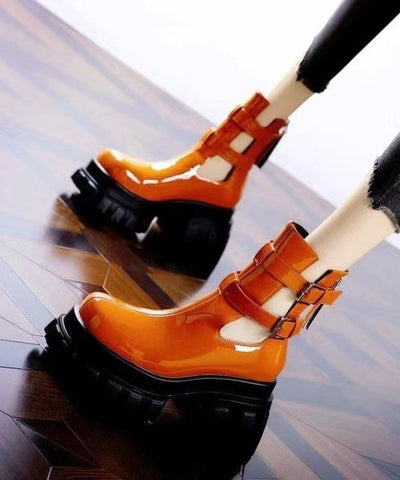 Botas gruesas únicas y cómodas de piel sintética ahuecadas de color naranja 