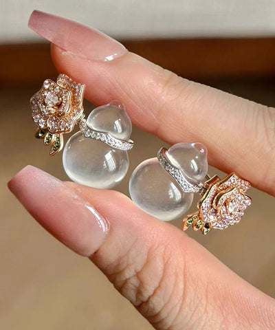 Pendientes de botón florales de calabaza, calcedonia y circonita de aleación color nude.