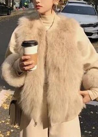 Elegante chaleco de piel y piel color albaricoque, sin mangas, con cuello redondo y cremallera 