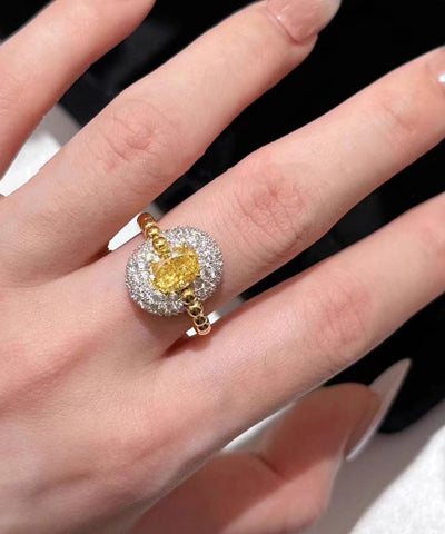 Anillos elegantes con forma de huevo de circonita dorada y cobre blanco 