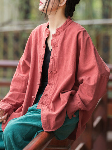 Blusas plisadas de color liso con cuello alto, mangas murciélago y botones de rana chinos sueltos. 