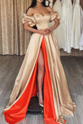 Vestido de fiesta largo color champán con hombros descubiertos y abertura delantera