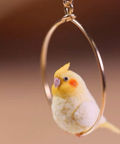 Lindos pendientes colgantes de loro en plata de ley dorada 