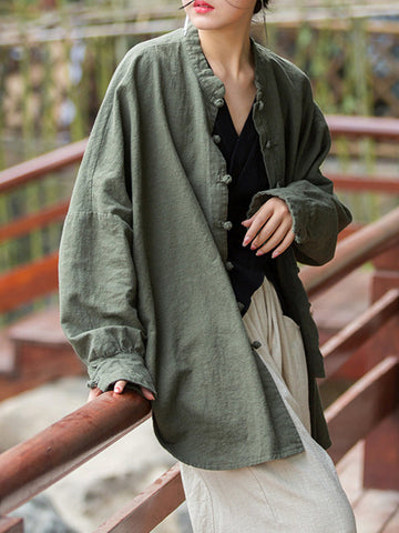 Blusas plisadas de color liso con cuello alto, mangas murciélago y botones de rana chinos sueltos. 