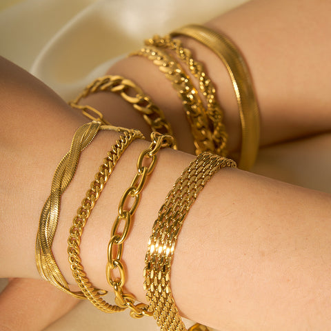 Pulseras de cadena de acero y titanio dorado con hueso de serpiente 