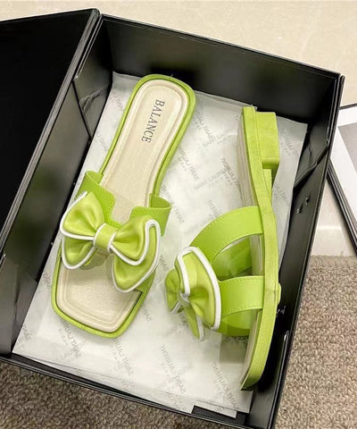Sandalias verdes elegantes con lazo y punta abierta 