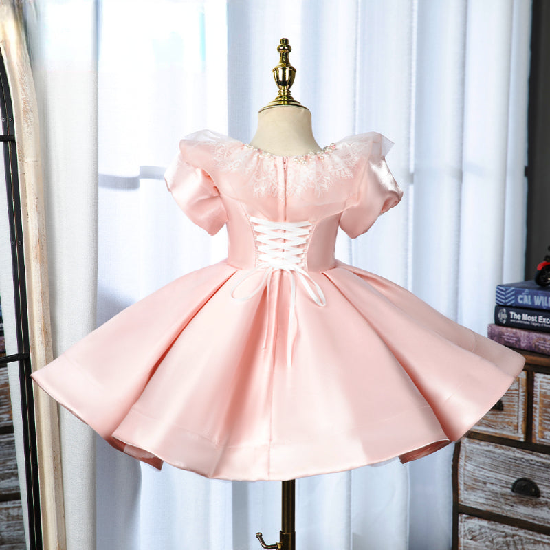 Elegantes rosa Prinzessinnenkleid mit Puffärmeln für Babys und Kleinkinder – auch ideal zur Erstkommunion 