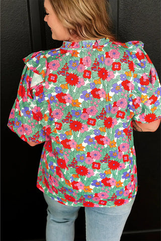 Blusa con mangas abullonadas y estampado floral multicolor vibrante 