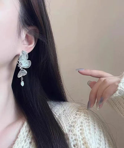 Pendientes de mariposa con circón de cobre y seda fina con agujeros 