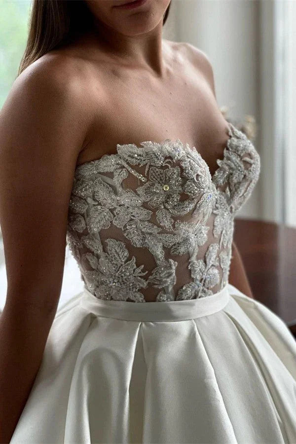 Elegante lange A-Linien-Hochzeitskleider aus Spitze und Satin mit Herzausschnitt