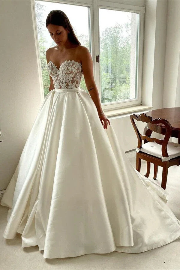 Elegante lange A-Linien-Hochzeitskleider aus Spitze und Satin mit Herzausschnitt