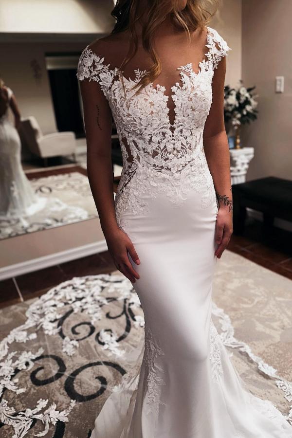 Elegante vestido de novia largo de sirena con escote corazón, sin mangas, con cola capilla y espalda descubierta